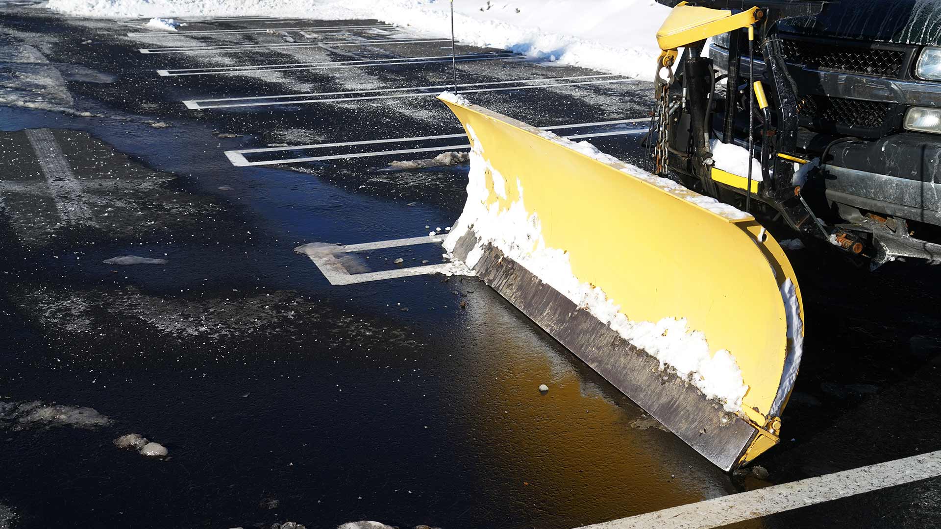 Commercial snow removal services for a parking lot in Calgary, Alberta.