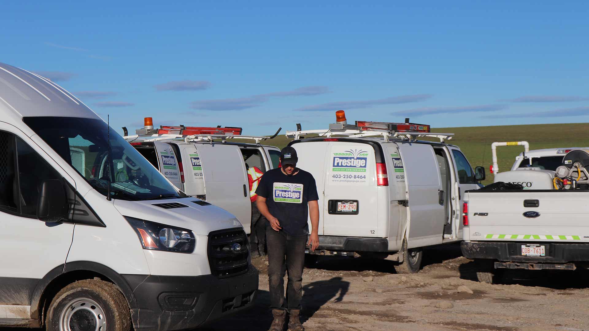 Prestige Outdoor Services work fleet preparing for a job in Airdrie, Alberta.