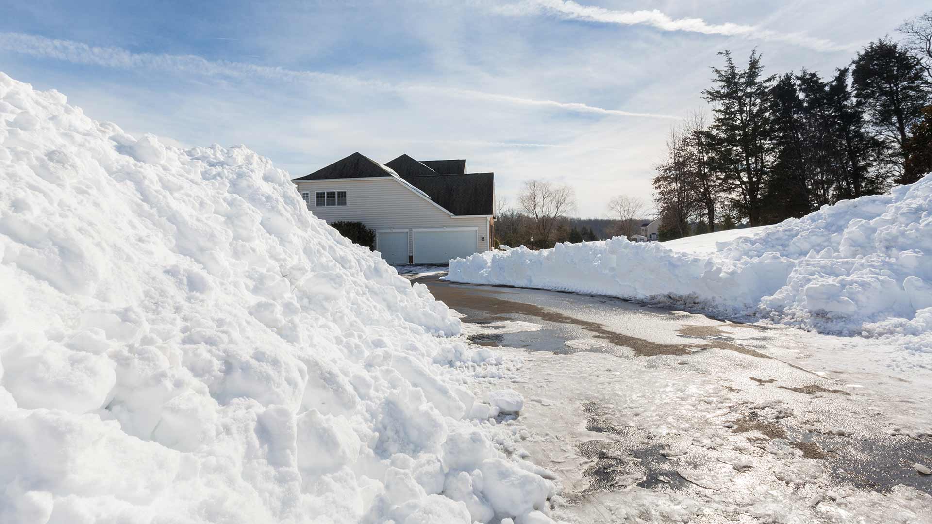 Snow removal services from a residential driveway in Calgary, AB.