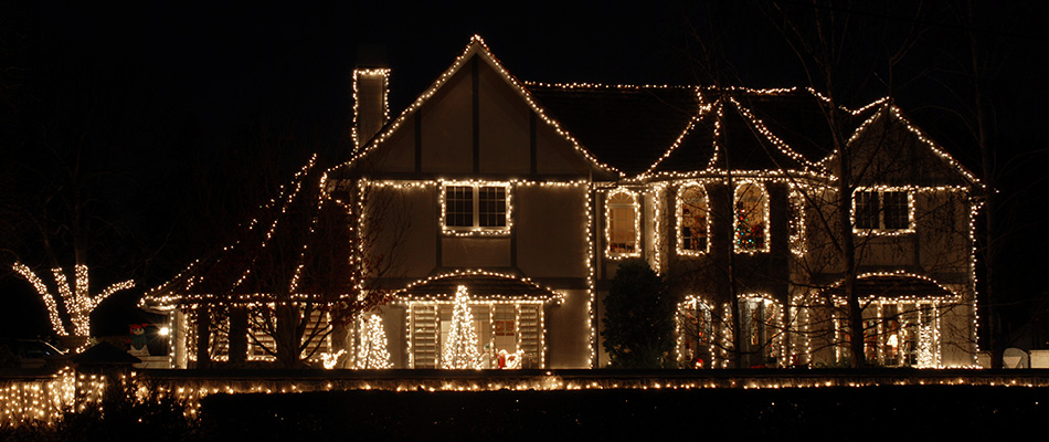 A home decorated in holiday lighting in Signal Hill, AB.