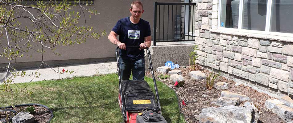 Lawn mowing services at a property near Airdrie, Alberta.