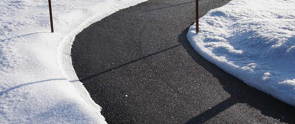 Snow removal from sidewalk near Southwest Calgary, AB.